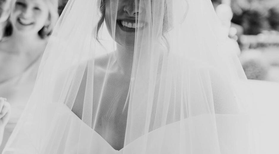 Bride smiling under veil at Helen Mcclurg Make Up Artist, Ballywalter, Northern Ireland, GB.