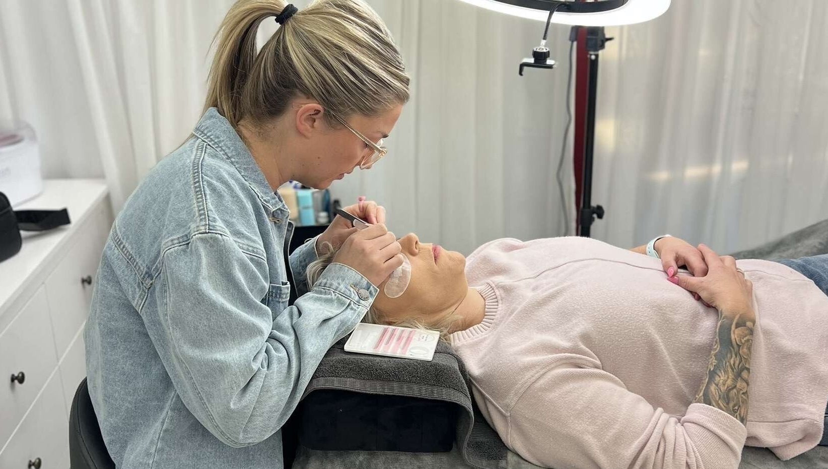 Aesthetician applies lash extensions at Willow and Sage Beauty, Moss Vale, New South Wales, AU.