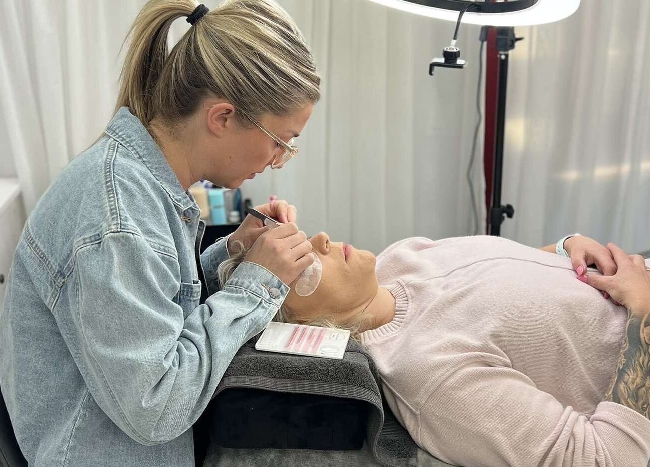 Aesthetician applies lash extensions at Willow and Sage Beauty, Moss Vale, New South Wales, AU.