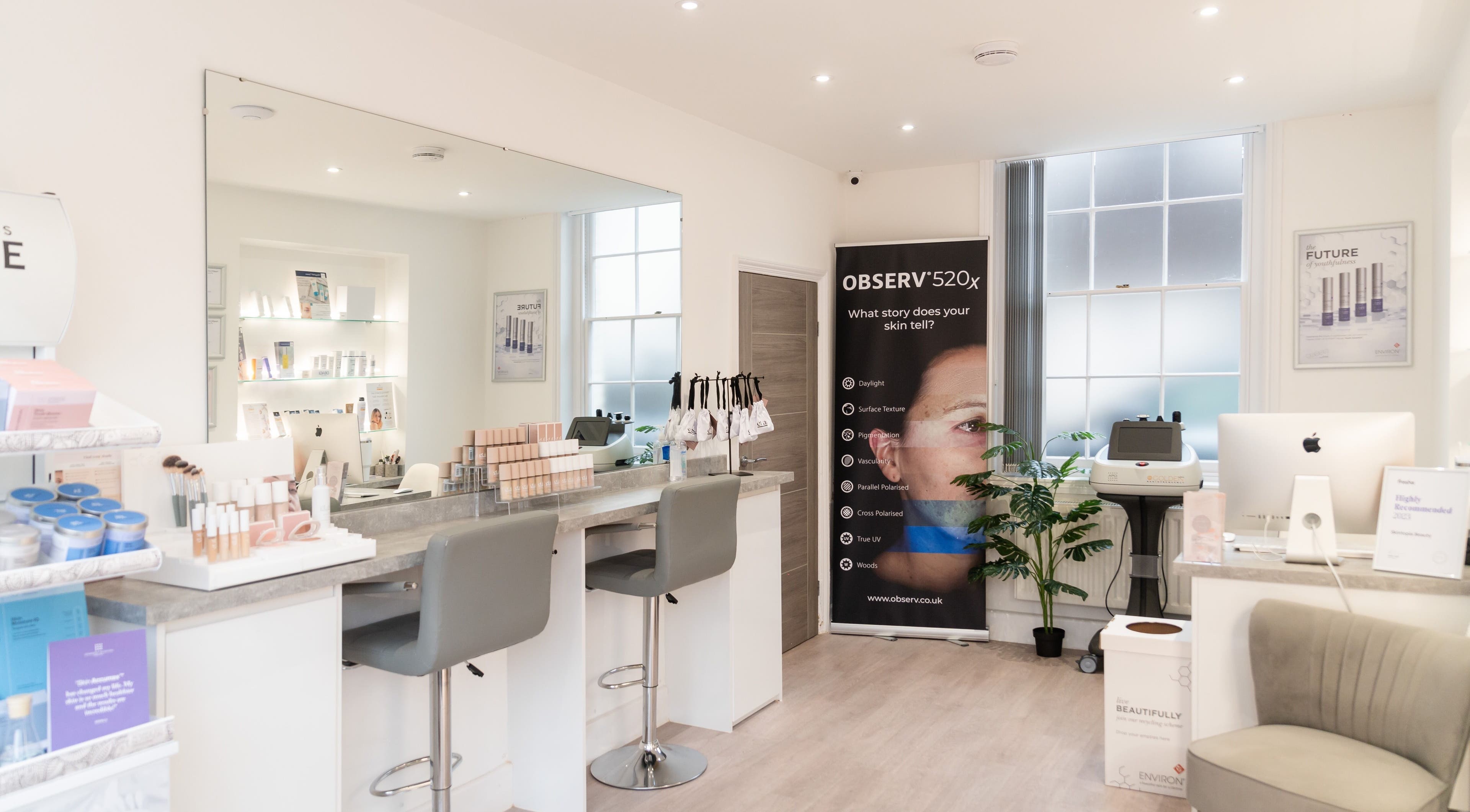 Skintopia Beauty's elegant skincare setup in Newport Pagnell, England, GB features sleek tools and cozy seating.