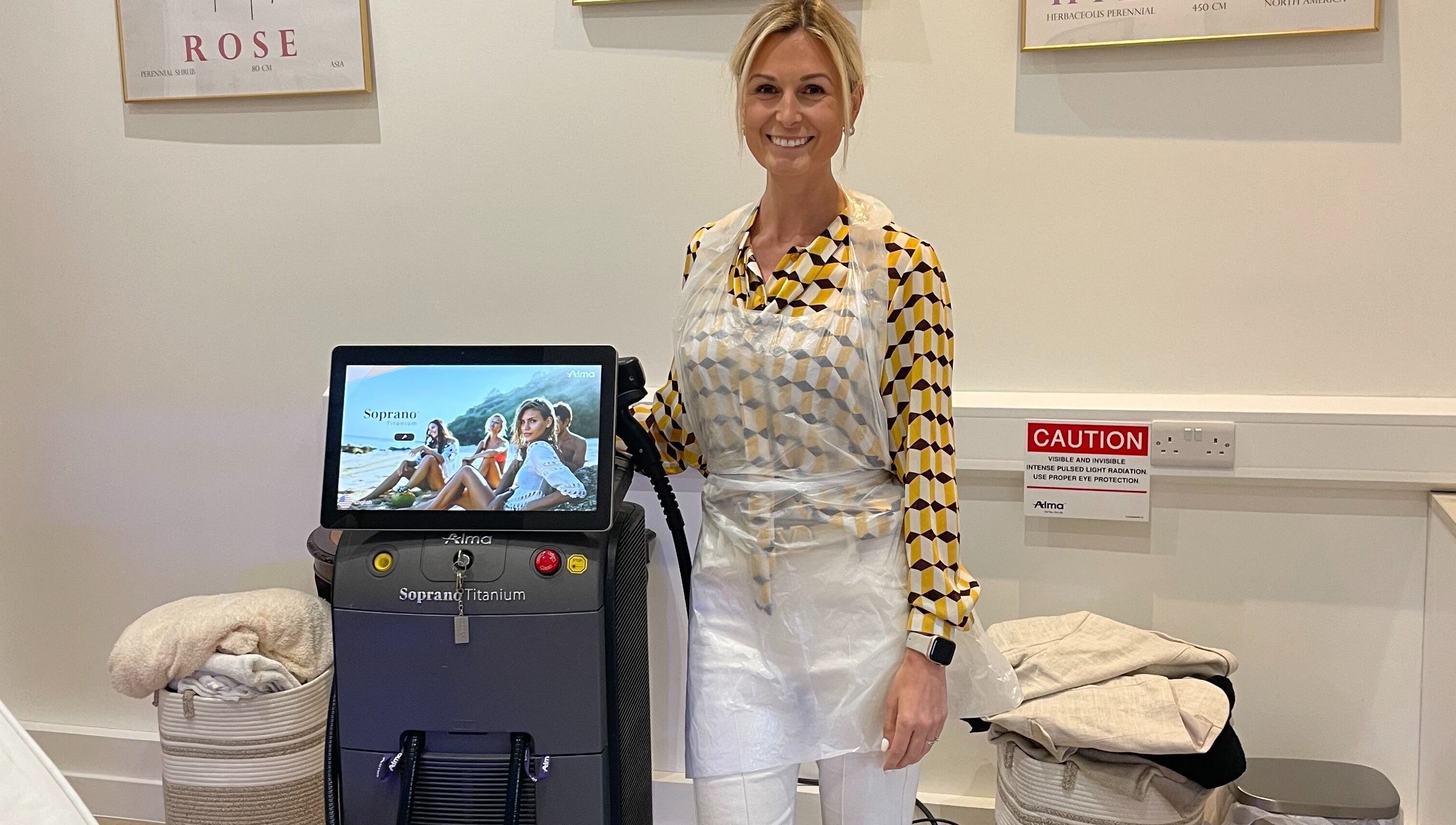 Professional at Bare & Brilliant, Lichfield, England, GB, next to advanced beauty equipment for treatments.