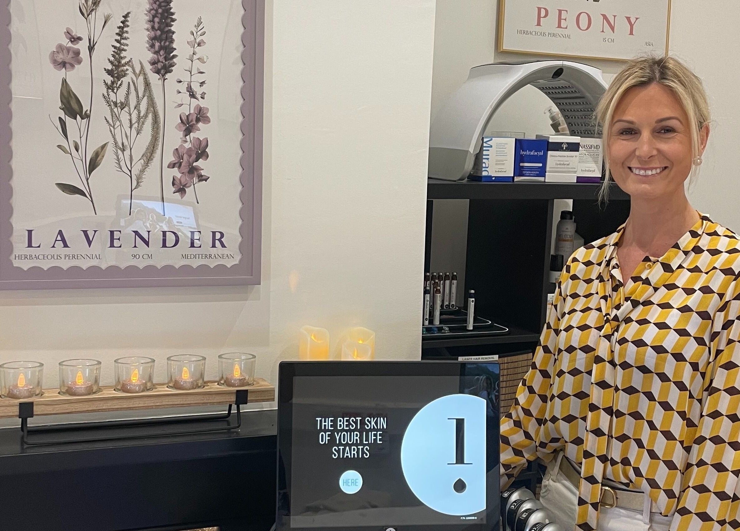 Reception area of Bare & Brilliant with candles and decor, located in Lichfield, England, GB.