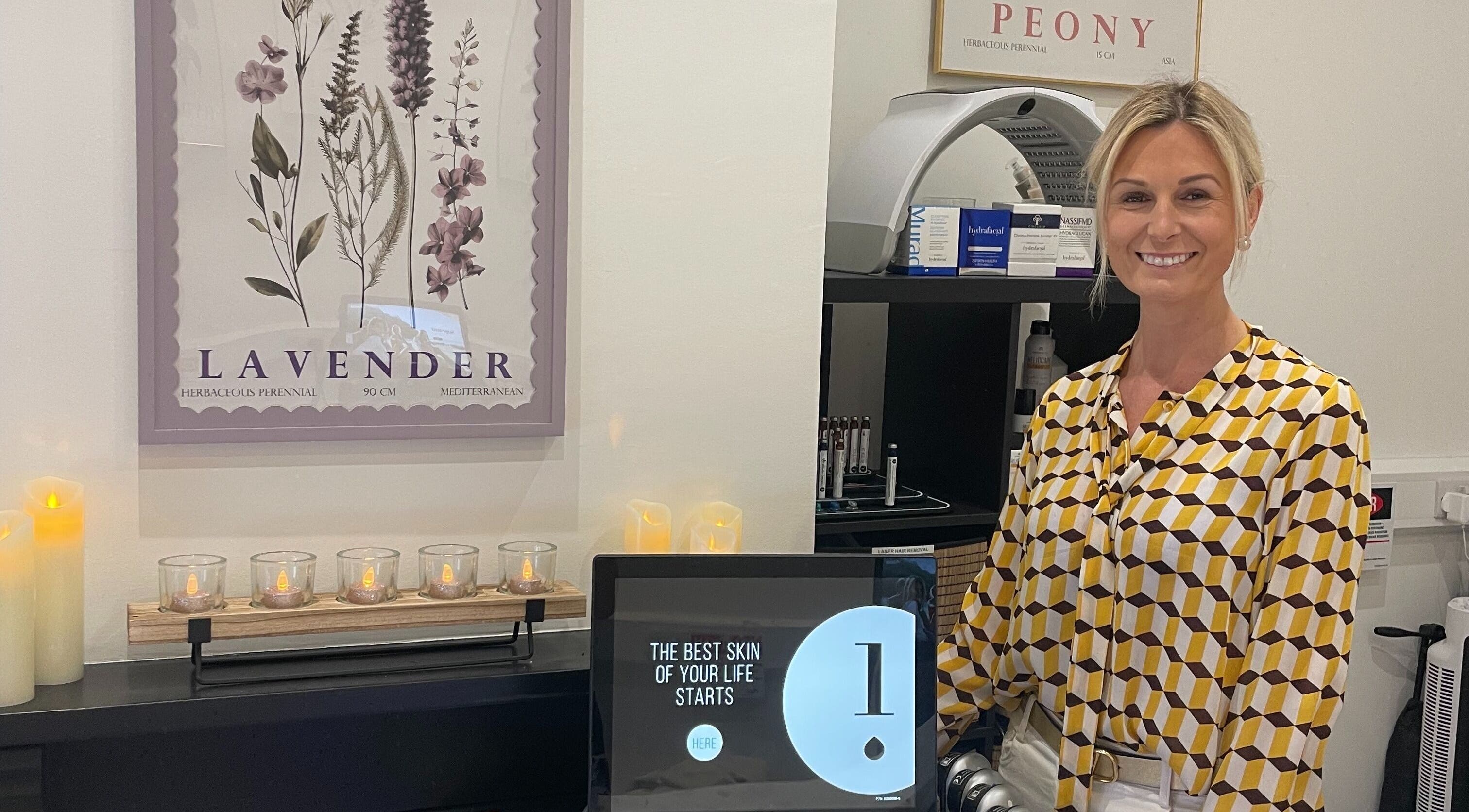 Reception area of Bare & Brilliant with candles and decor, located in Lichfield, England, GB.