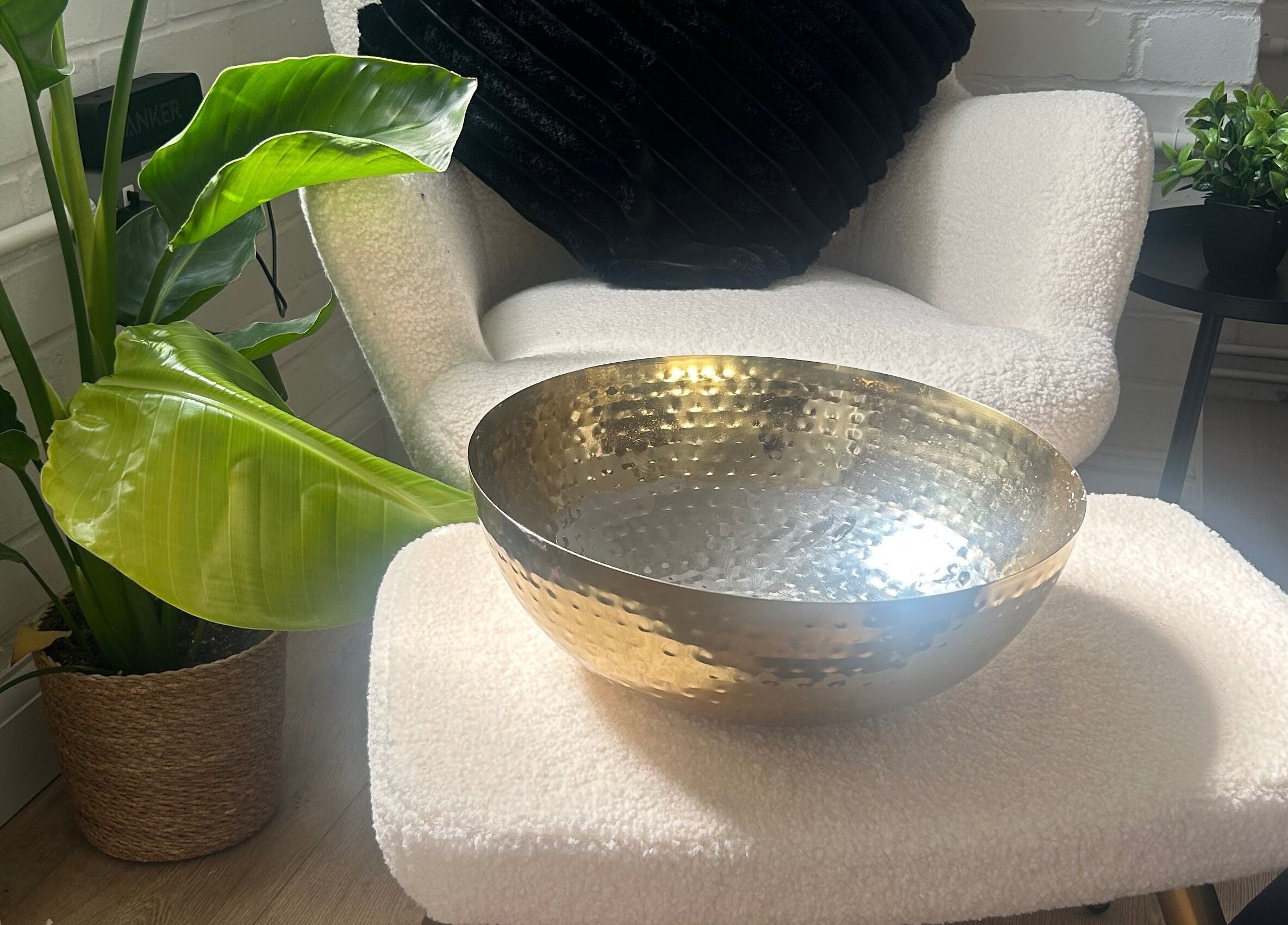 Stylish interior at Expressions Beauty Studios, Leighton Buzzard, featuring a cozy chair and decor.