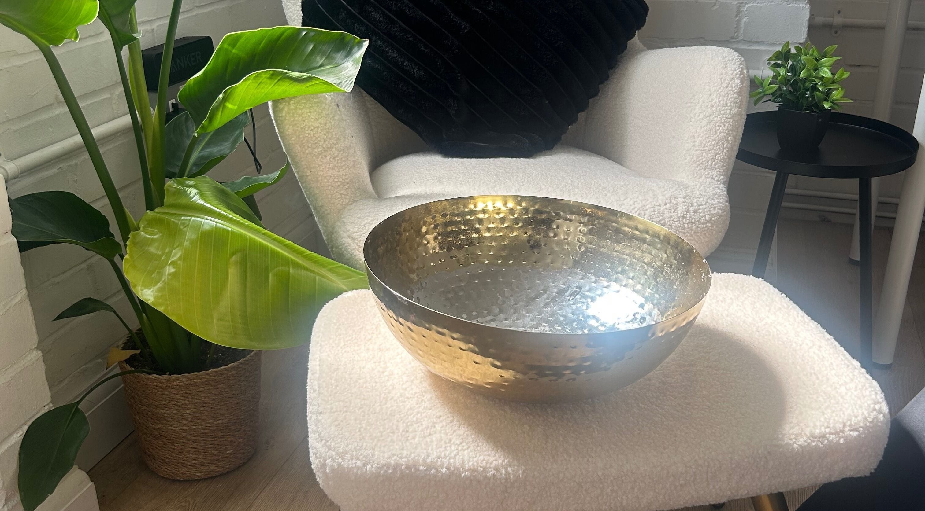 Stylish interior at Expressions Beauty Studios, Leighton Buzzard, featuring a cozy chair and decor.