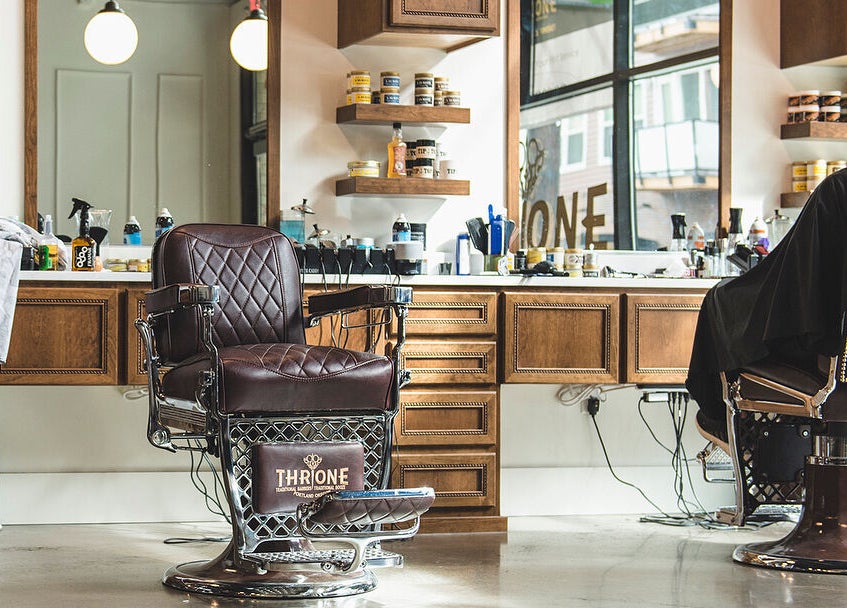 Interior of Throne Traditional Barbershop on Williams, Portland, Oregon, US, showcasing vintage barber chairs.