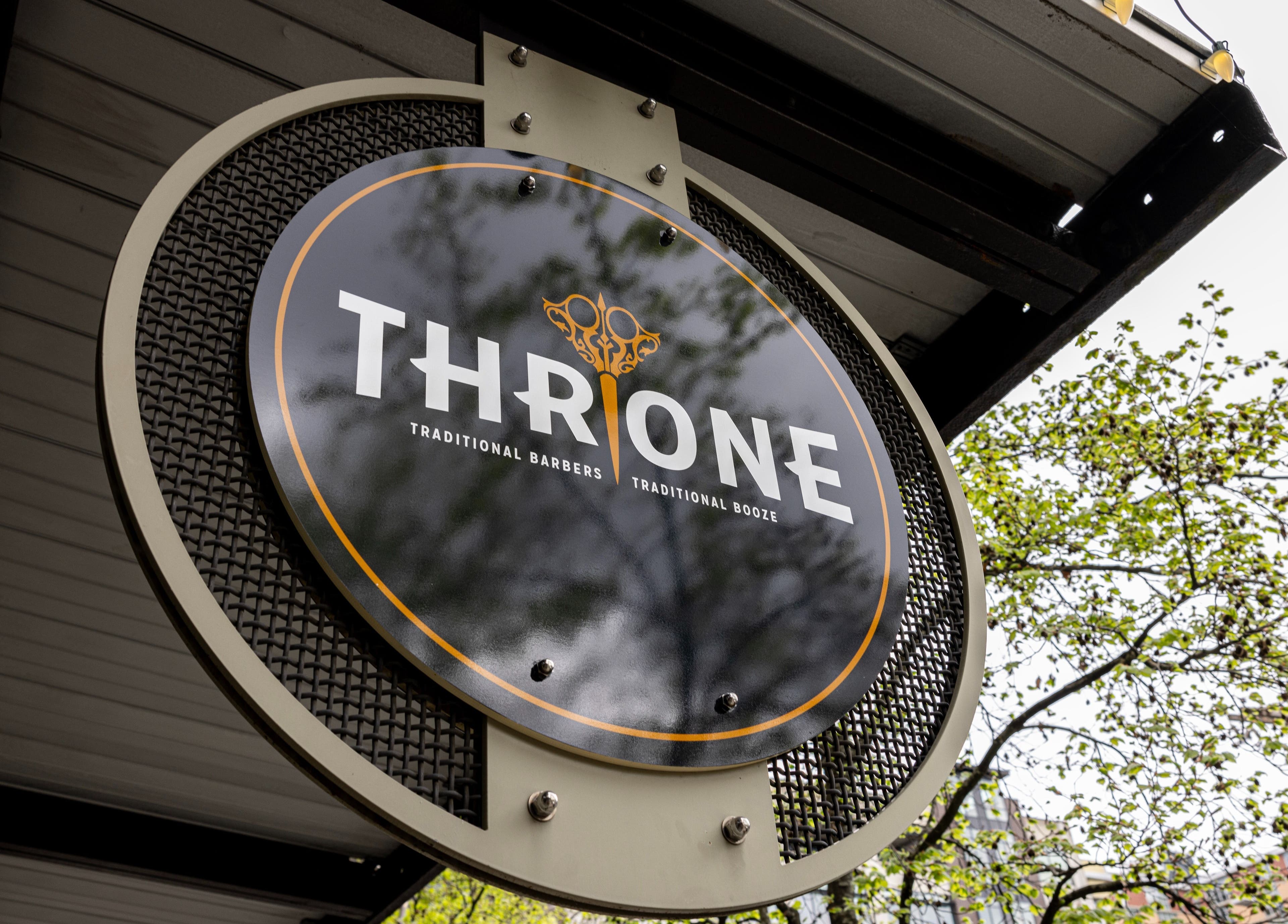 Throne Traditional Barbershop at the Pearl sign in Portland, Oregon, US with a stylish design.