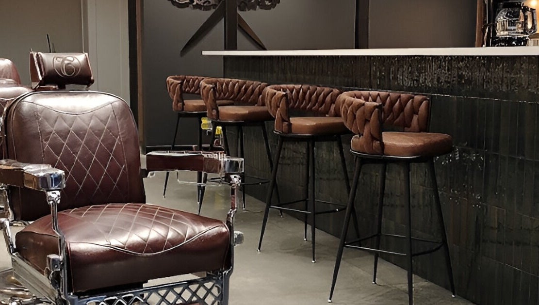 Leather chairs at Throne Traditional Barbershop on Division, Portland, Oregon, US, offer classic comfort and style.