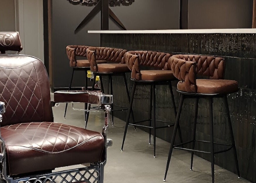 Leather chairs at Throne Traditional Barbershop on Division, Portland, Oregon, US, offer classic comfort and style.