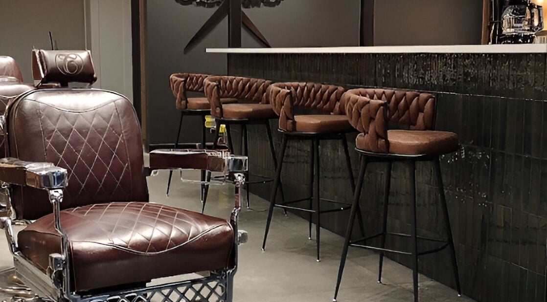 Leather chairs at Throne Traditional Barbershop on Division, Portland, Oregon, US, offer classic comfort and style.