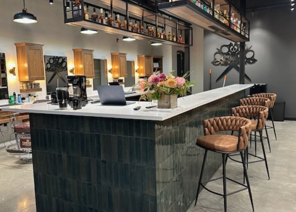 Inside Throne Traditional Barbershop on Division, Portland, Oregon, US. Elegant chairs and modern decor.