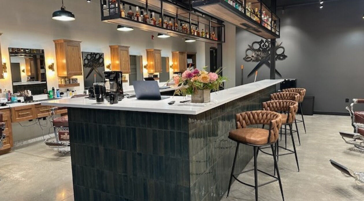 Inside Throne Traditional Barbershop on Division, Portland, Oregon, US. Elegant chairs and modern decor.