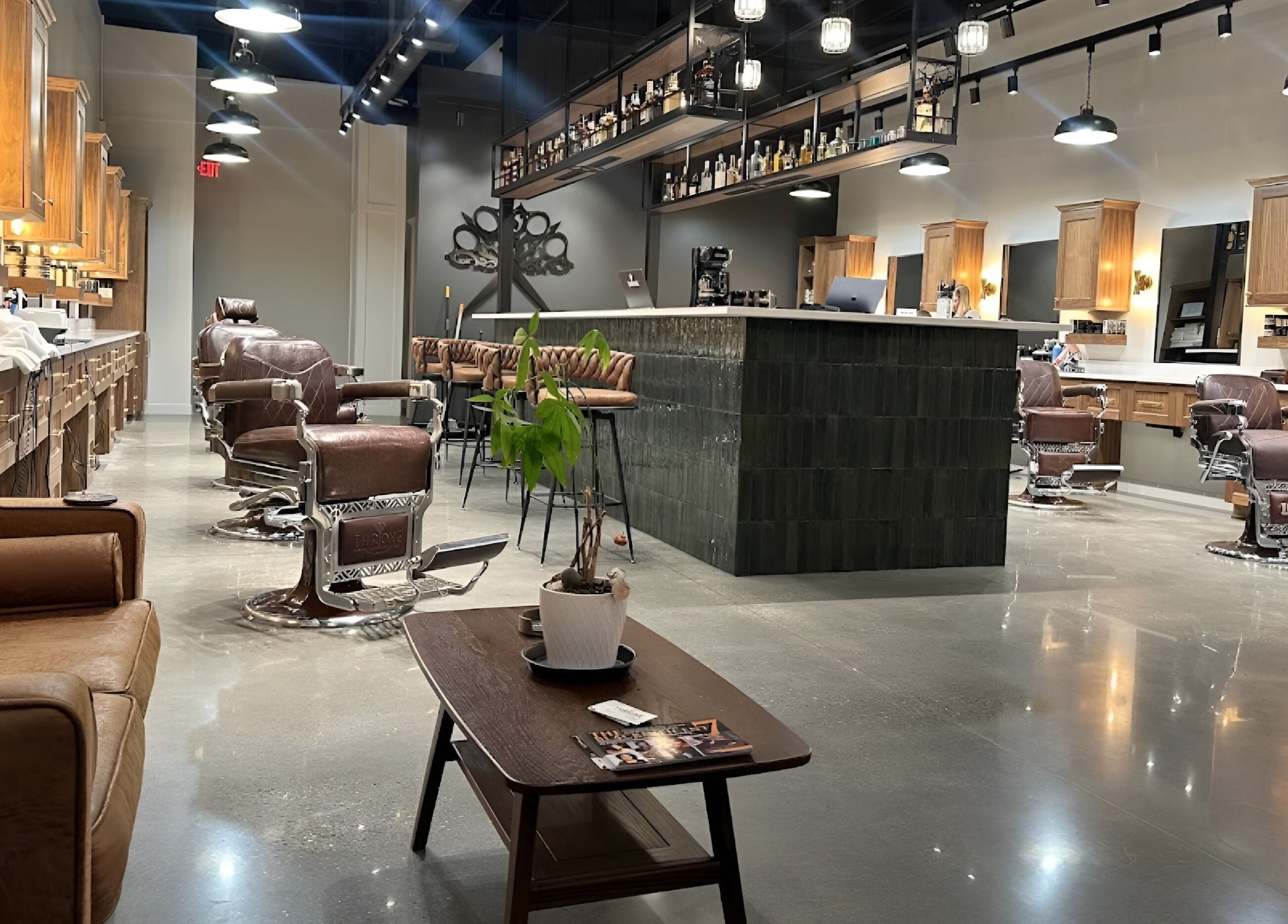 Interior of Throne Traditional Barbershop on Division, Portland, Oregon, US, featuring leather chairs and modern decor.