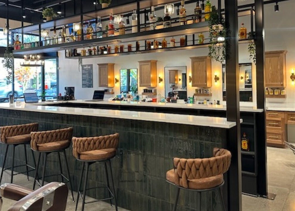 Modern interior of Throne Traditional Barbershop on Division in Portland, Oregon, US, featuring elegant decor.