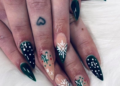 Festive green and white snowflake nails by Bloodstone Nail Designs, La Valle, Wisconsin, US.