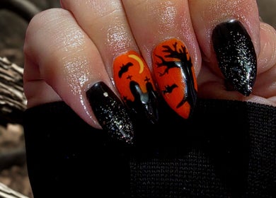 Halloween-themed nail art at Bloodstone Nail Designs, La Valle, Wisconsin, US. Featuring silhouettes on black and orange.