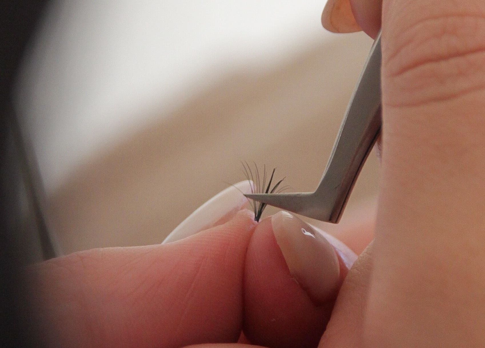 Close-up of eyelash extension being applied at SLIQ Studio, Pretoria, Gauteng, ZA.