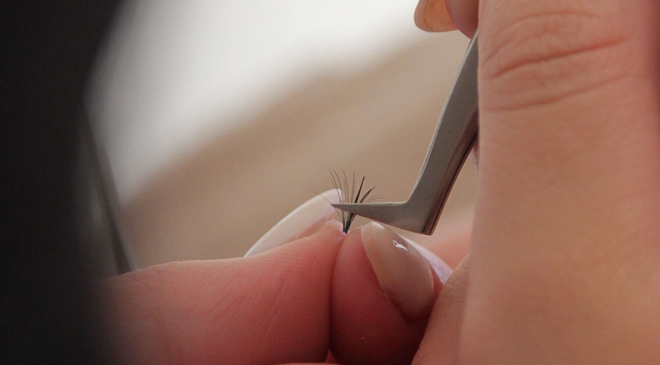 Close-up of eyelash extension being applied at SLIQ Studio, Pretoria, Gauteng, ZA.
