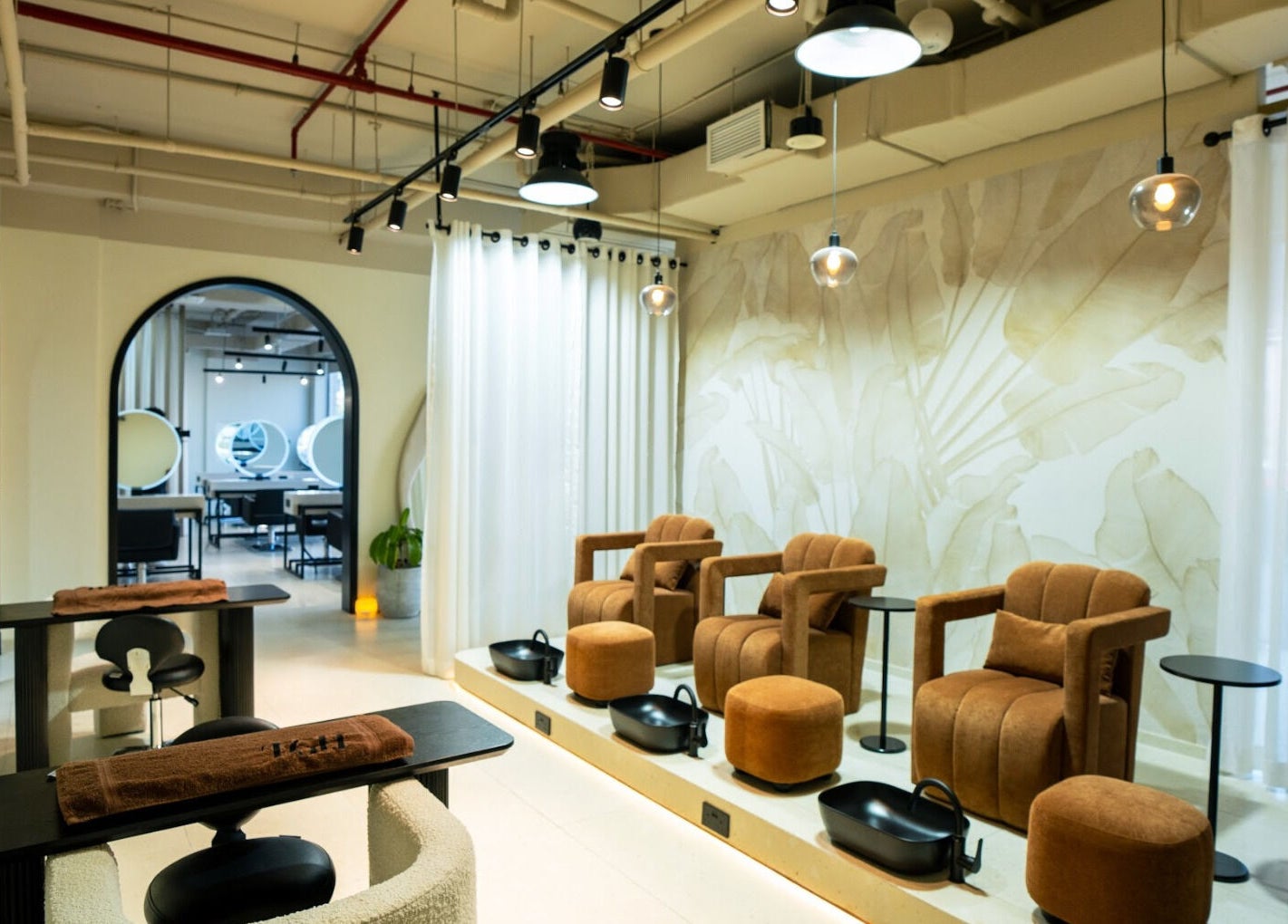 Spacious lounge at The Green House in Dubai, Dubai, AE with cozy chairs and elegant decor.