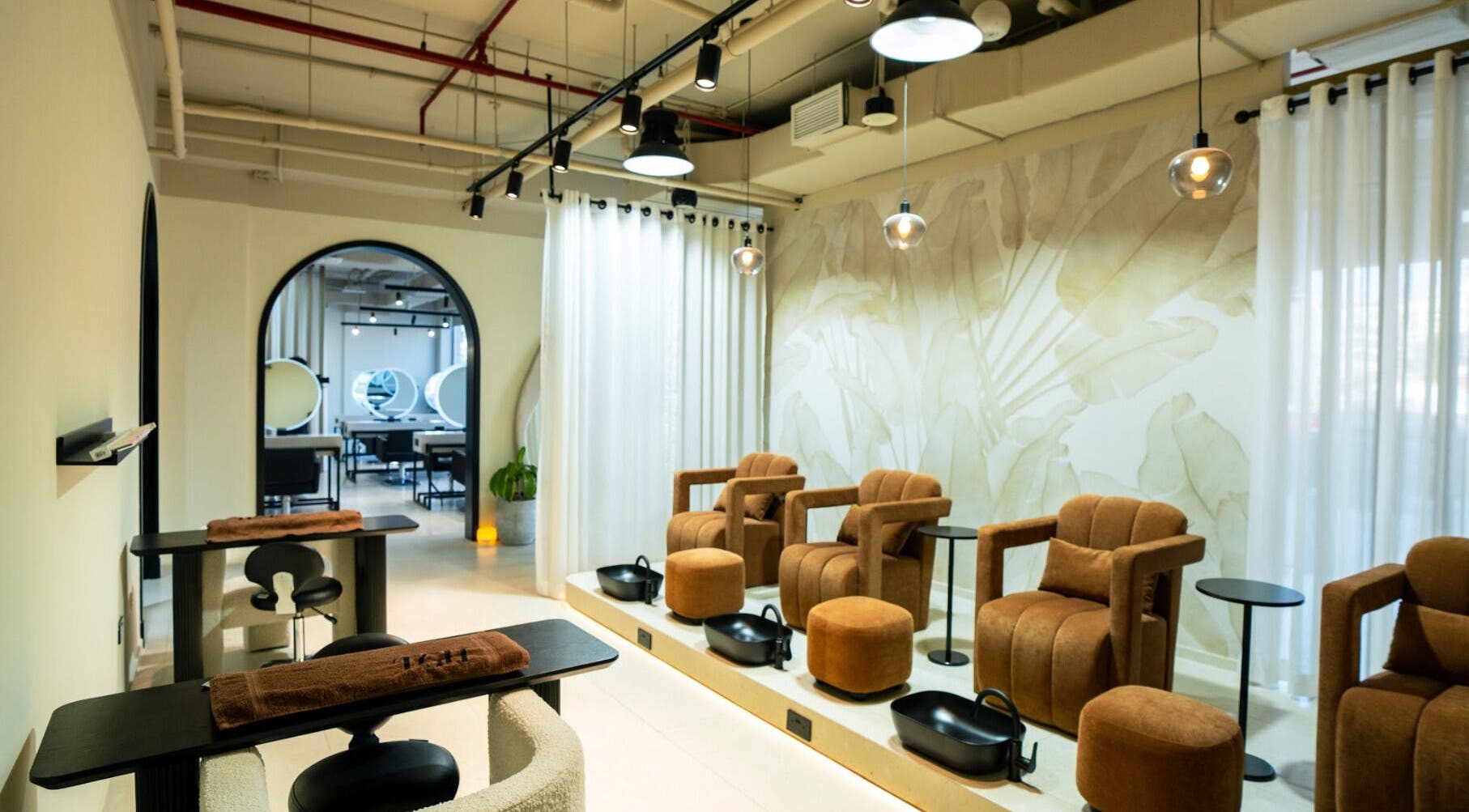 Spacious lounge at The Green House in Dubai, Dubai, AE with cozy chairs and elegant decor.