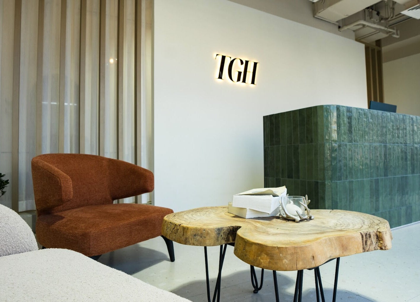 Reception area of The Green House in Dubai, Dubai, AE, featuring modern furniture and welcoming decor.