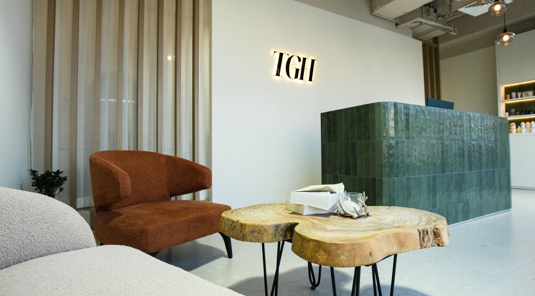 Reception area of The Green House in Dubai, Dubai, AE, featuring modern furniture and welcoming decor.