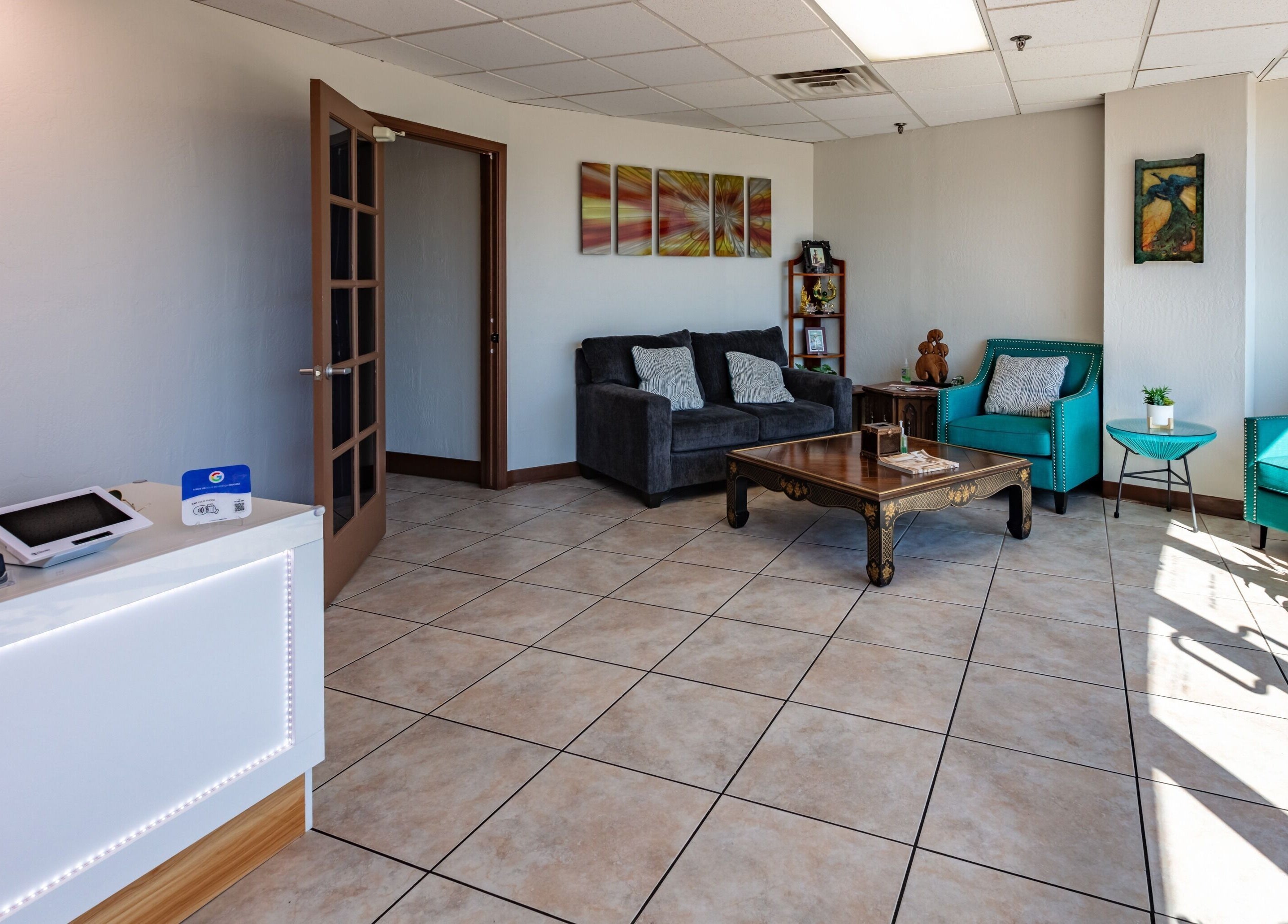 Cozy reception at Thai Balinese Massage & Spa, Scottsdale, Arizona, with plush seating and elegant decor.