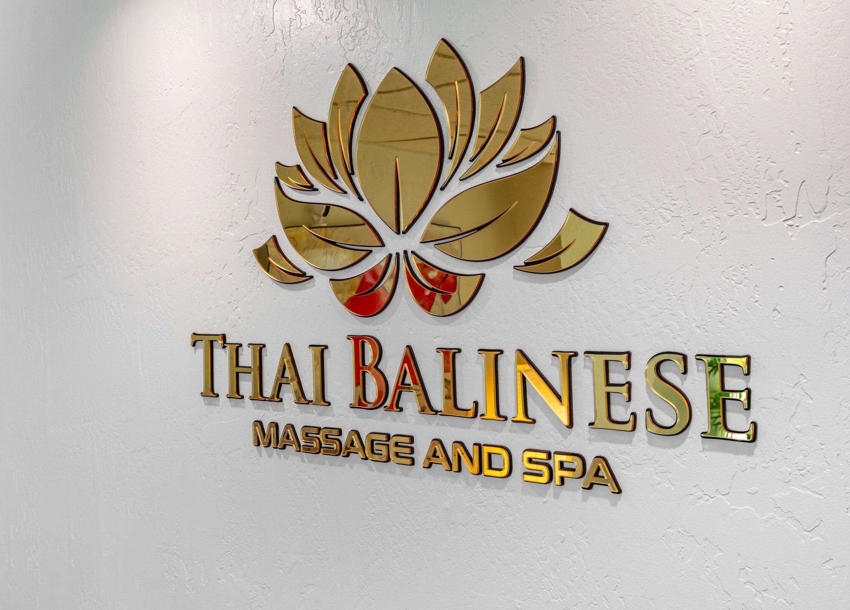 Thai Balinese Massage & Spa logo with golden lotus design in Scottsdale, Arizona, US.