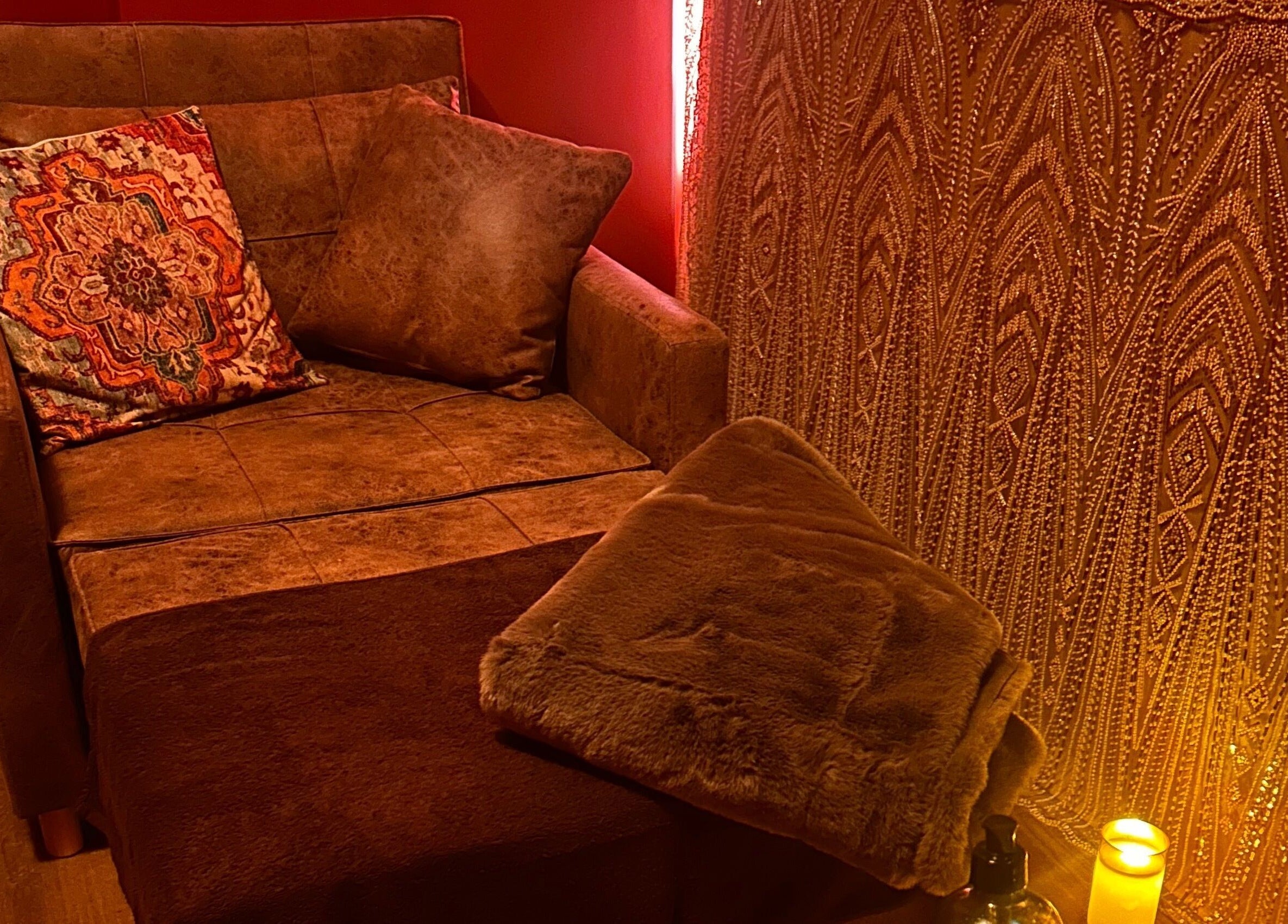 Comfortable lounge chair and soft lighting at Urban Spa, Swansea, Wales, GB for ultimate relaxation.