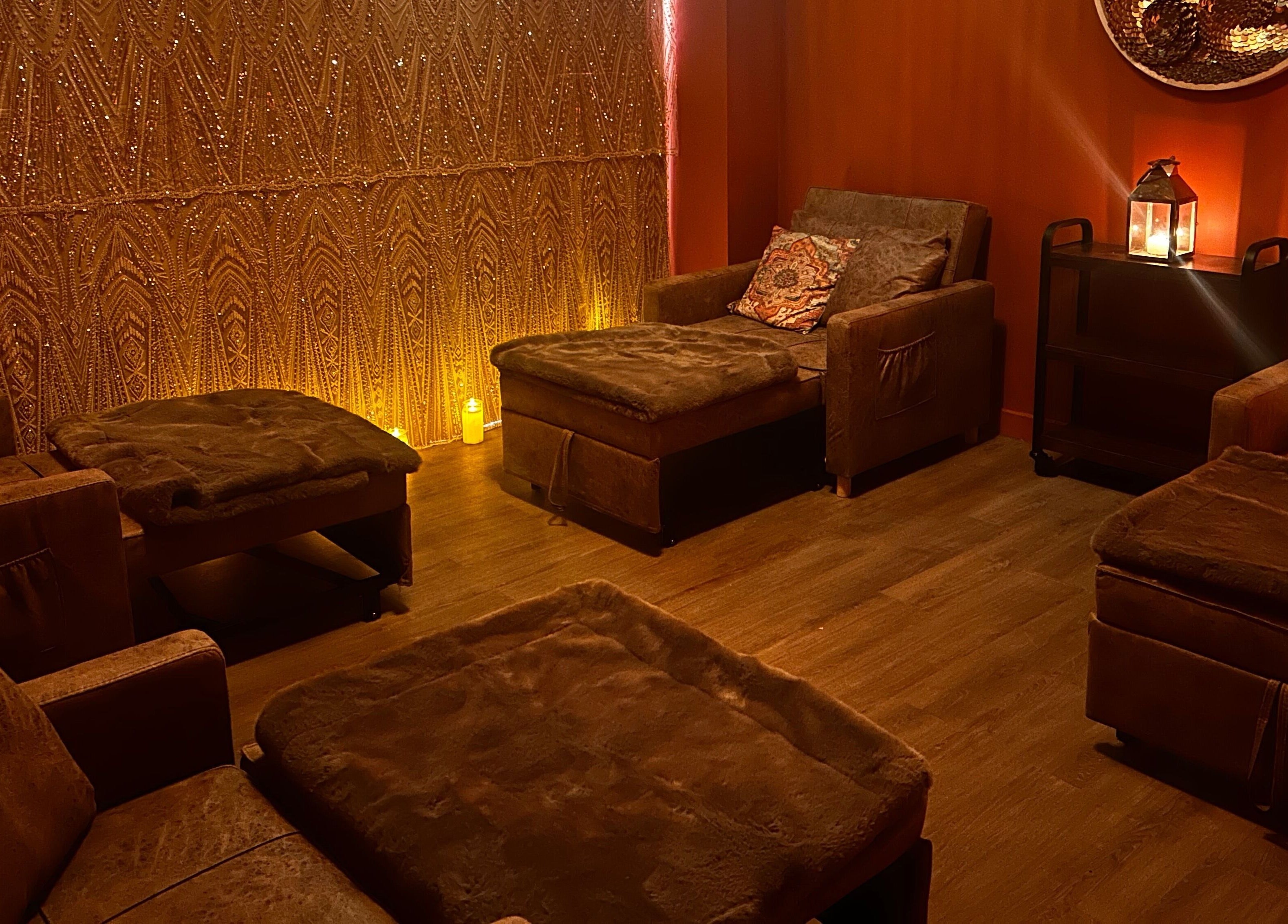 Warm, inviting lounge area in Urban Spa, Swansea, Wales, GB with plush seating and ambient lighting.