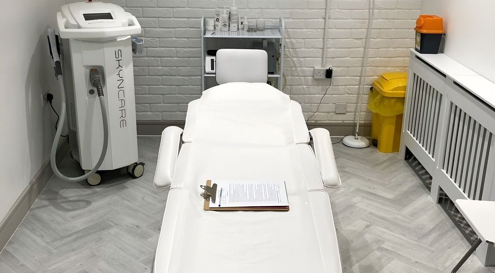 Treatment room at Samantha Maunder Skin & Laser, Penarth, Wales, GB, featuring Skincare machine and relaxing setup.