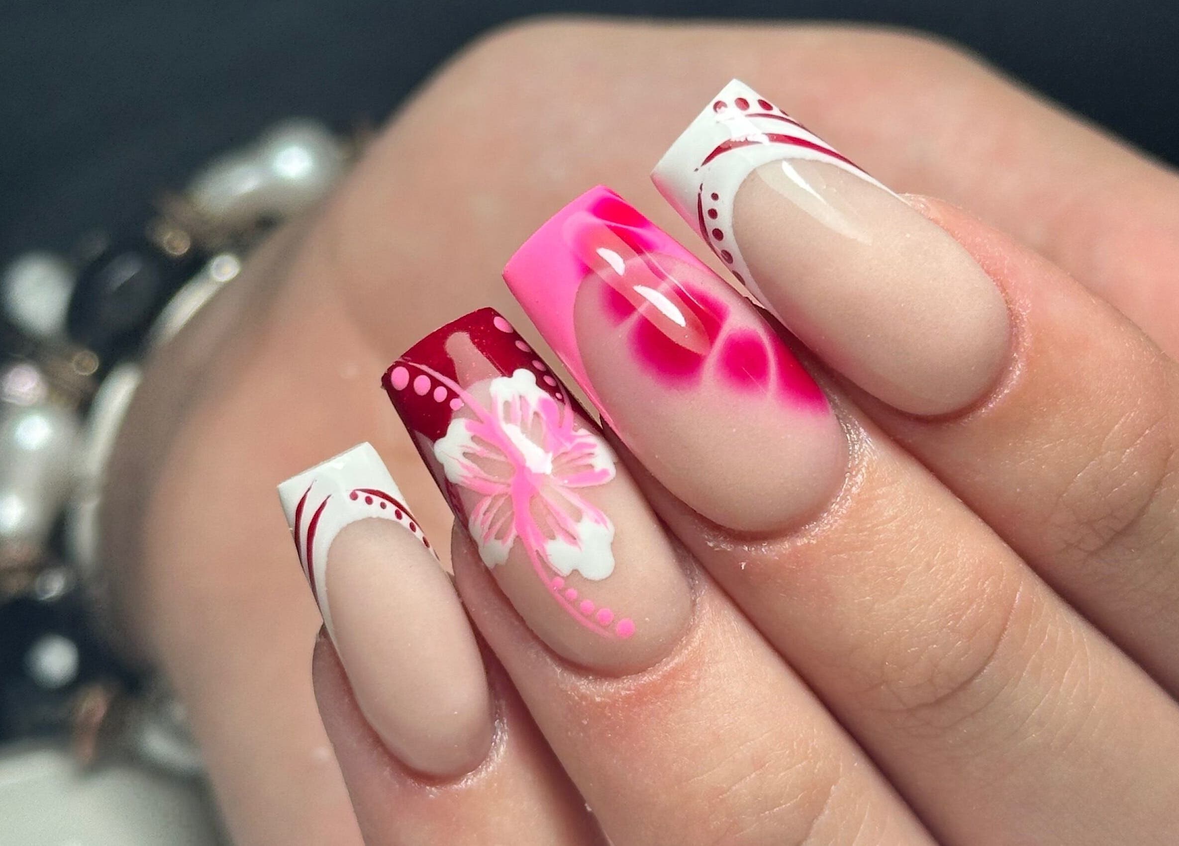 Vibrant floral nail art at LKR Beauty, Wigan, England, GB. Perfect for stylish, elegant beauty transformations.