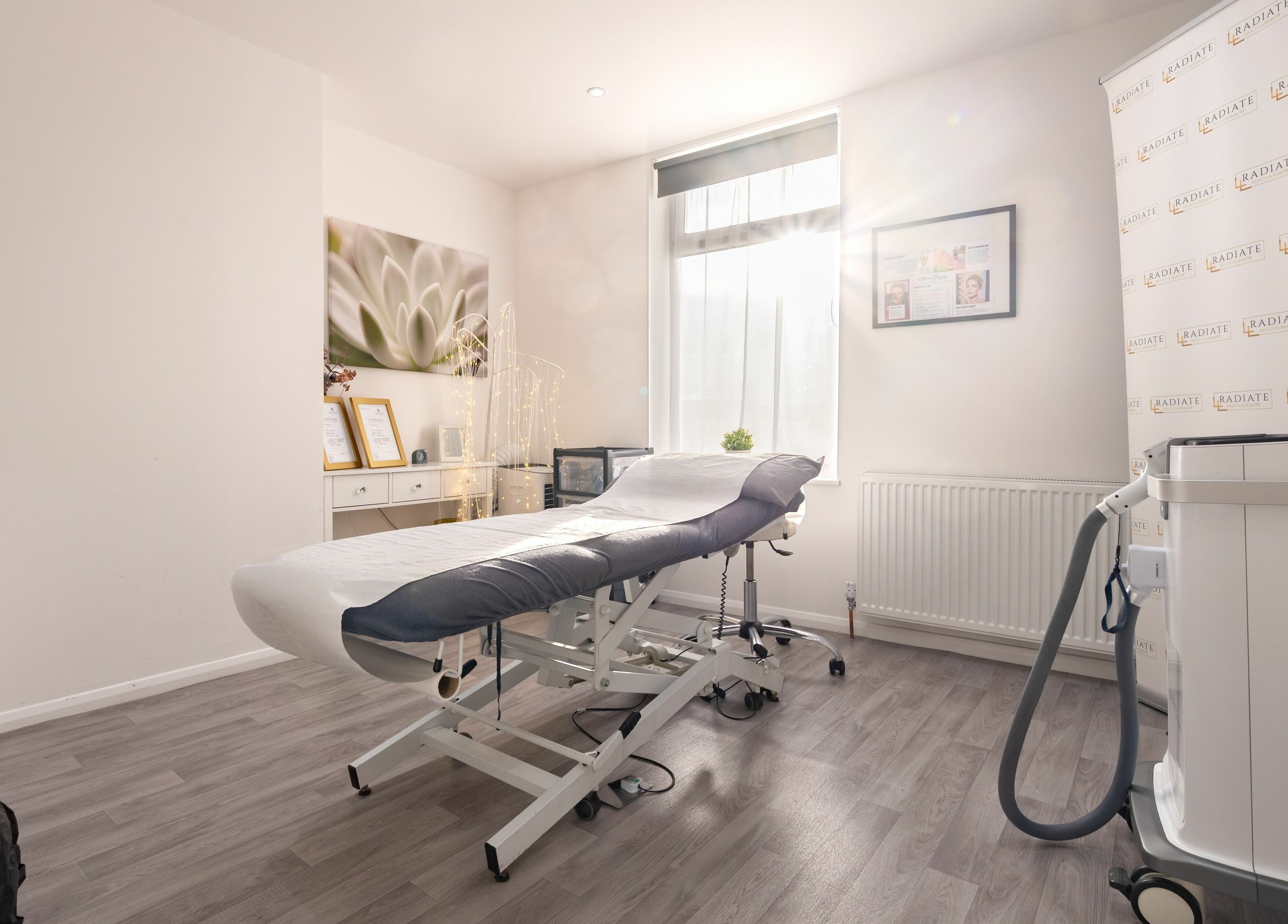 Tranquil treatment room at Radiate Health and Beauty in Stockport, England, GB with modern equipment and decor.