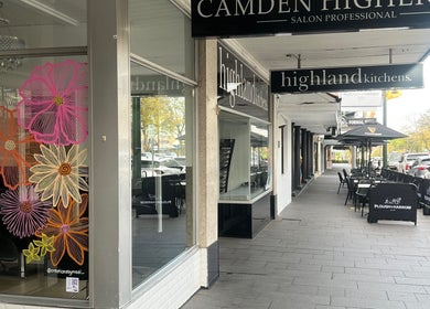 Exterior of Hair Artistry Studio in Camden, NSW with colorful floral window design.