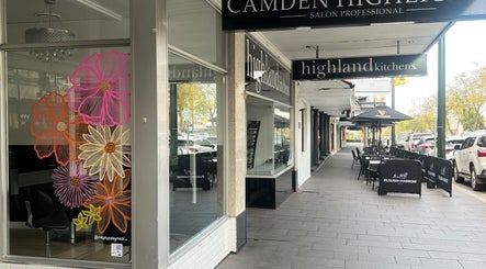 Exterior of Hair Artistry Studio in Camden, NSW with colorful floral window design.