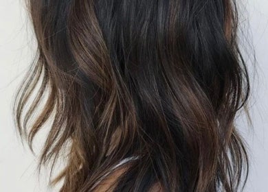 Elegant brown hair waves styled at Hair Artistry Studio, Camden, New South Wales, AU.