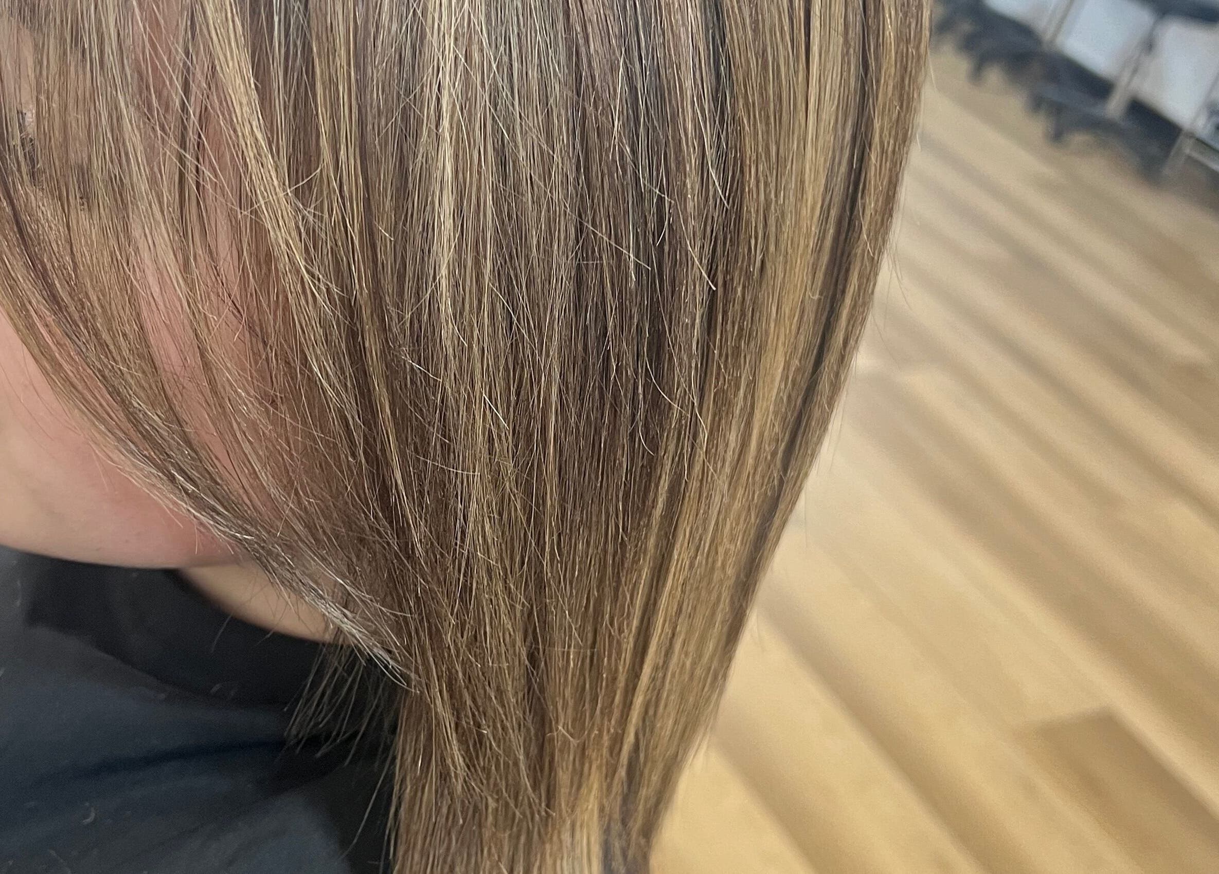Smooth, highlighted hair at Hair Artistry Studio in Camden, New South Wales, AU.
