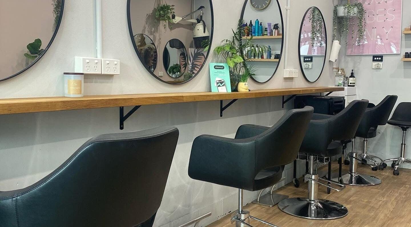 Elegant styling chairs and mirrors at Hair Artistry Studio in Camden, New South Wales, AU.