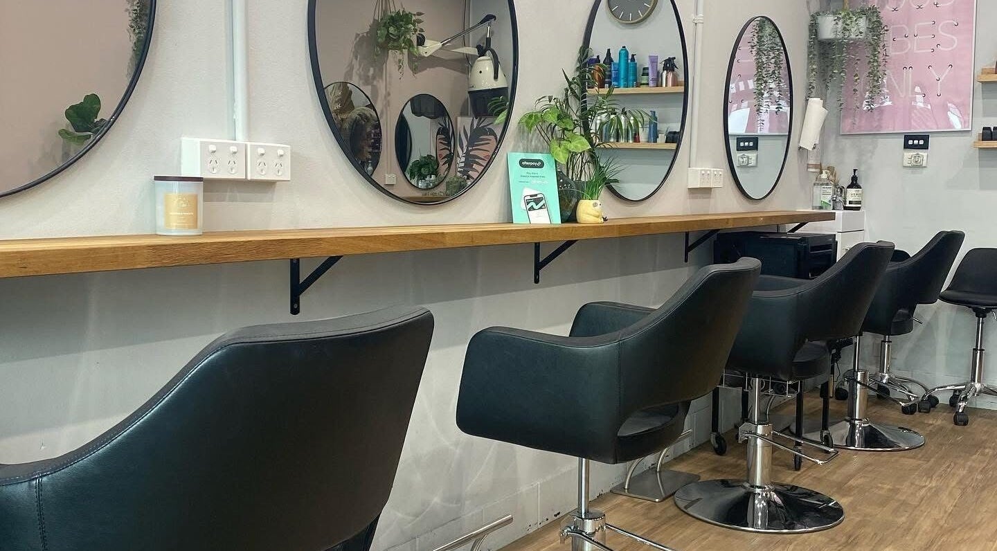 Elegant styling chairs and mirrors at Hair Artistry Studio in Camden, New South Wales, AU.