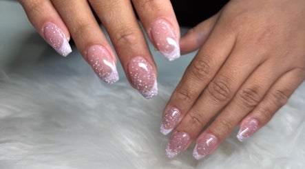 Sparkling pink nails at Myrakia Beauty & Laser Bar, Benoni, Gauteng, ZA showcasing elegant design.