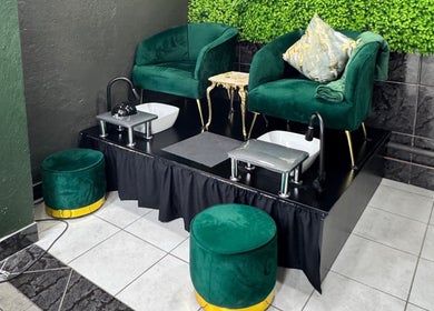 Elegant pedicure chairs at Myrakia Beauty & Laser Bar, Benoni, Gauteng, ZA, set against lush greenery.