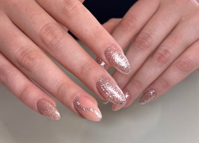 Elegant glitter nails at Myrakia Beauty & Laser Bar in Benoni, Gauteng, ZA showcasing expert manicure.