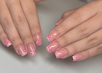 Beautiful floral nail art design at Myrakia Beauty & Laser Bar, Benoni, Gauteng, ZA, showcasing glossy pink nails.