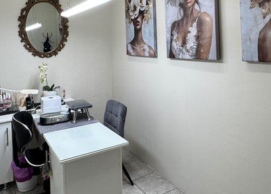 Elegant treatment room at Myrakia Beauty & Laser Bar in Benoni, Gauteng, ZA, featuring art and modern decor.