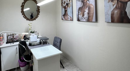 Elegant treatment room at Myrakia Beauty & Laser Bar in Benoni, Gauteng, ZA, featuring art and modern decor.