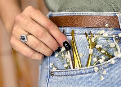 Close-up of manicure tools in a denim pocket at Myrakia Beauty & Laser Bar, Benoni, Gauteng, ZA.