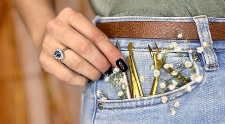 Close-up of manicure tools in a denim pocket at Myrakia Beauty & Laser Bar, Benoni, Gauteng, ZA.