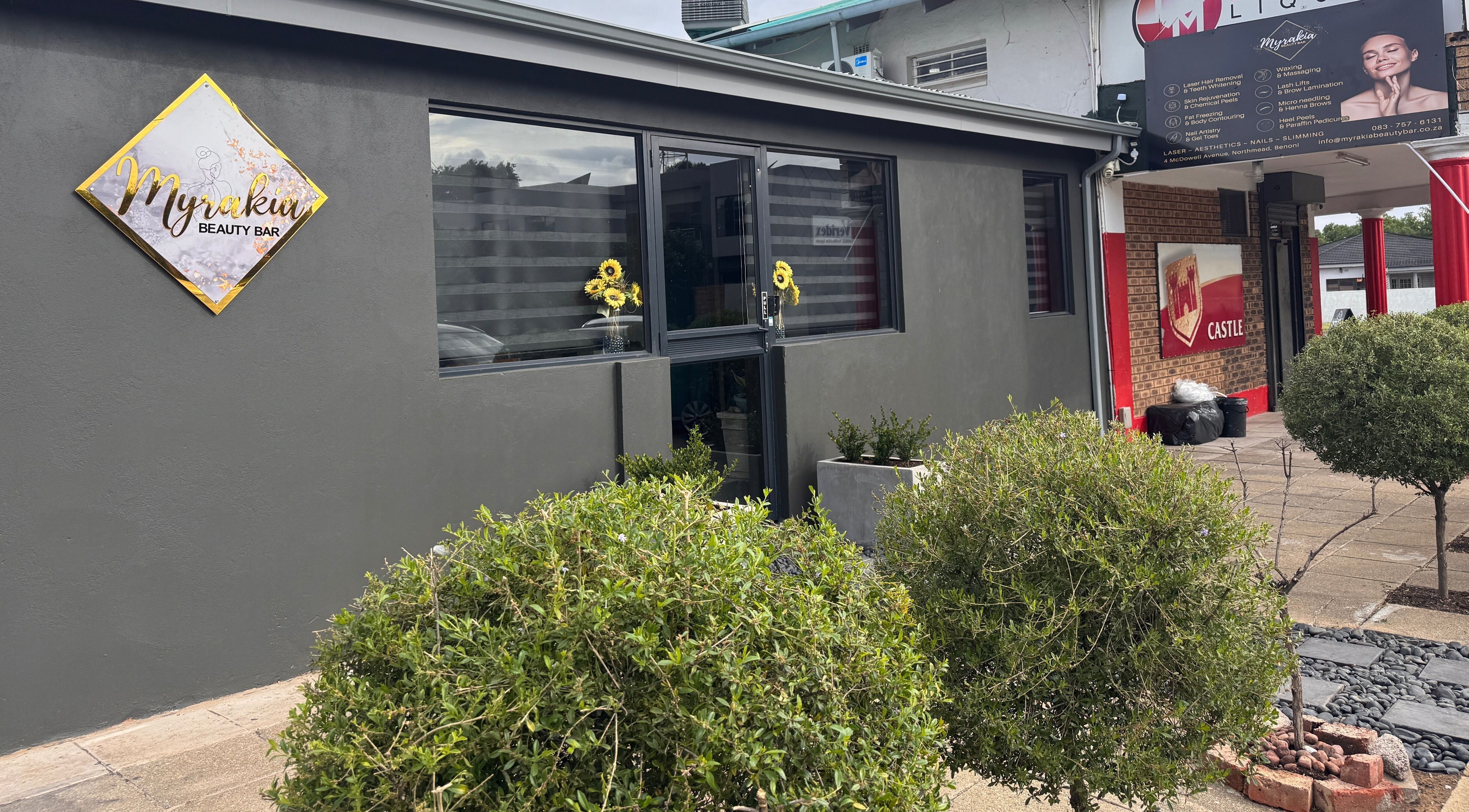 Front view of Myrakia Beauty & Aesthetics Bar in Benoni, Gauteng, ZA, surrounded by lush greenery.