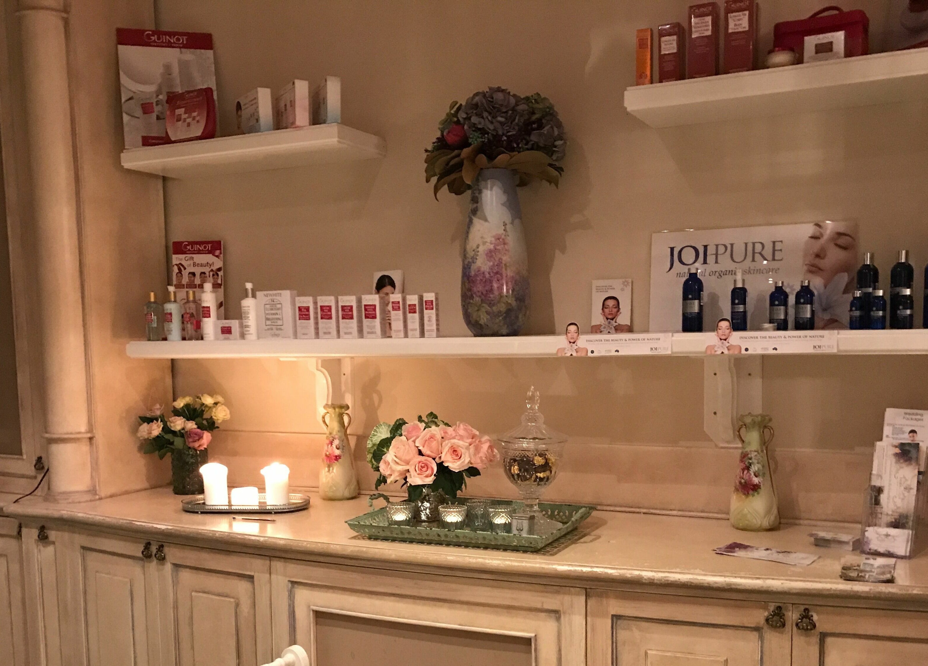 Product display at Brookleigh Beauty and Spa, Upper Swan, Western Australia, AU with candles and flowers.