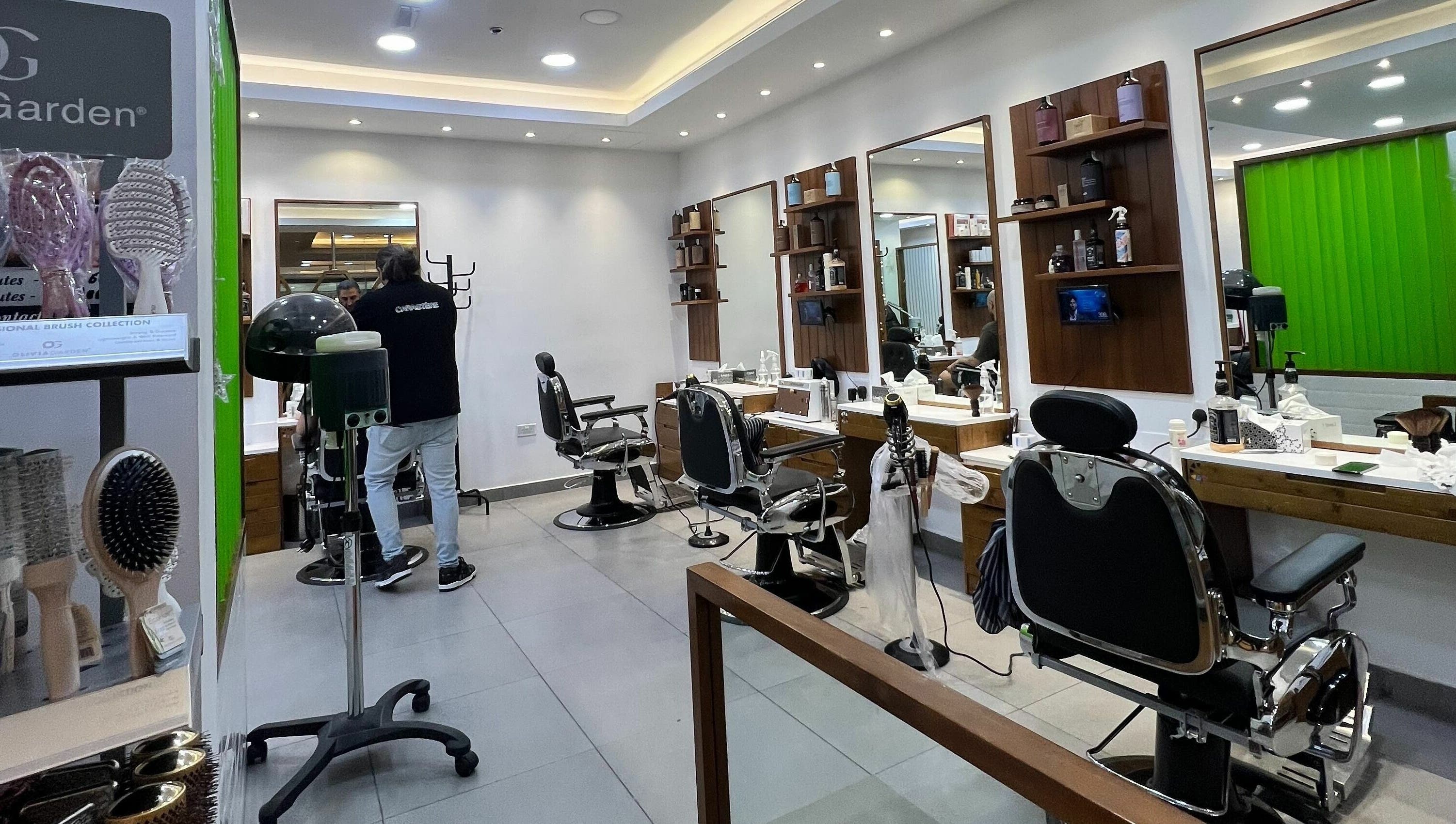 Modern salon chairs and mirrors at Caractere Salon Mall of the Emirates, Dubai, AE.